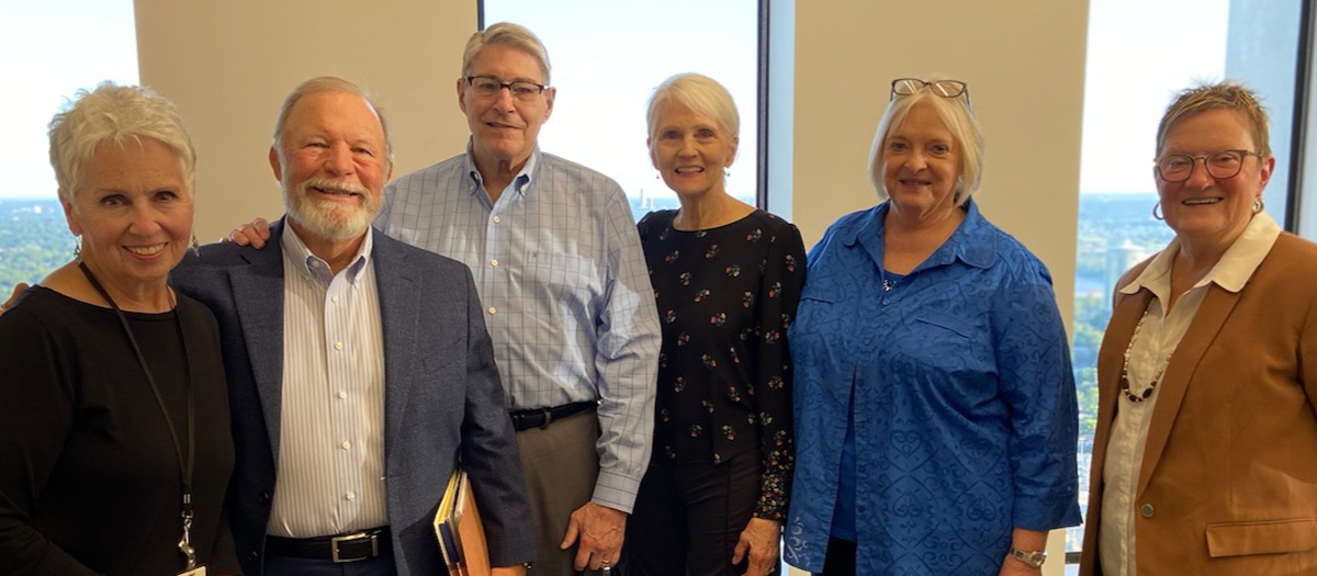 Jim Green poses with attorneys and staff from Conner & Winters at his retirement party